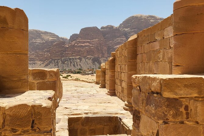2 Day Wadi Rum Tour: Traditional Dinner and Starlit Cave Camp - Khazali Canyon and ancient rock inscriptions