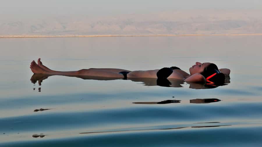 Amman: Dead Sea Day Tour with Optional Entry Fees and Lunch - Entering the resort beach at Holiday Inn or Crowne Plaza