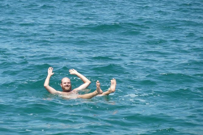 Dead Sea Full Day Tour including Lunch - Floating in water that barely lets you sink