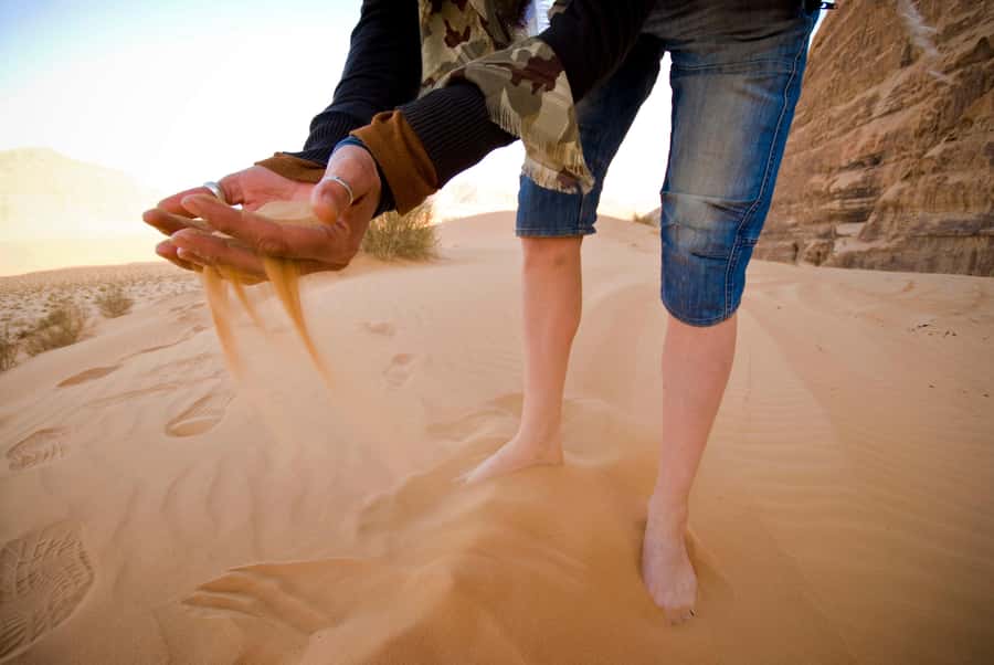 Wadi Rum: Explore 10-Hour Jeep Tour Pass, Guide, Meal & Stay - Riding through the red desert