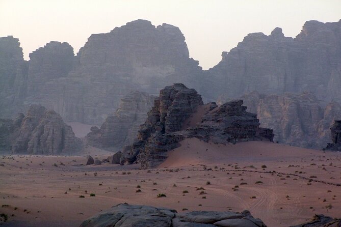 Wadi Rum: Explorer Jeep Tour PASS + Local Food + Optional Stay - Khazali Canyon and the desert’s old markings